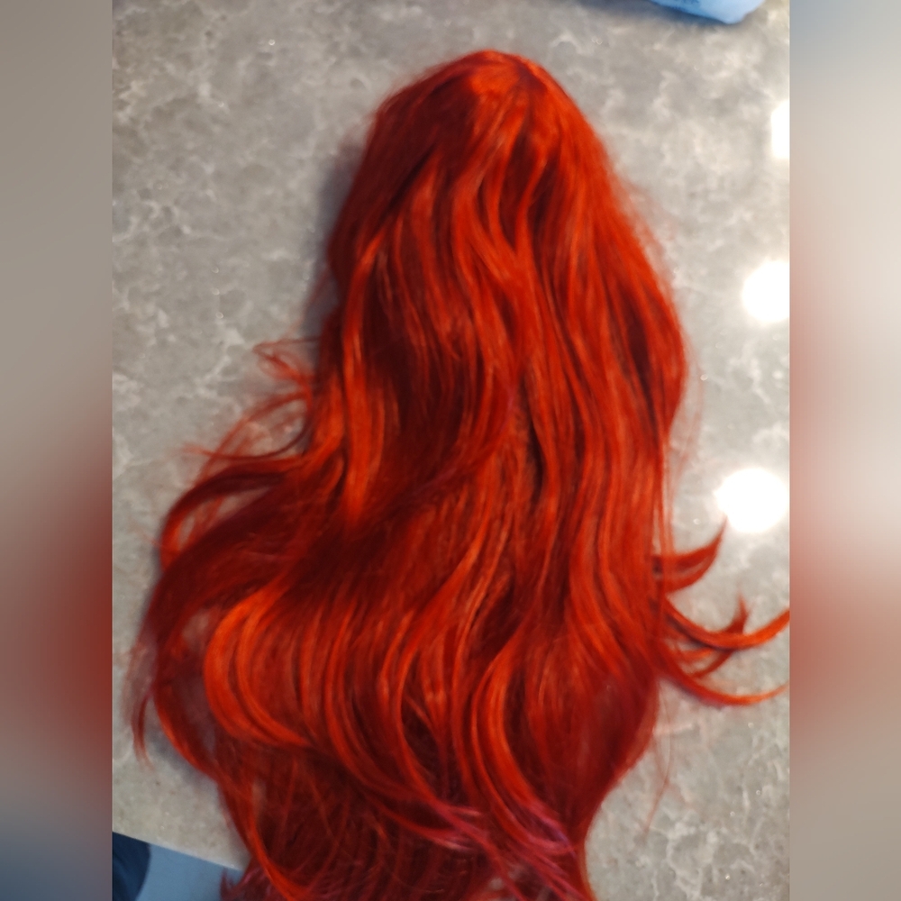 Vibrant red long wig layered with wig cap New